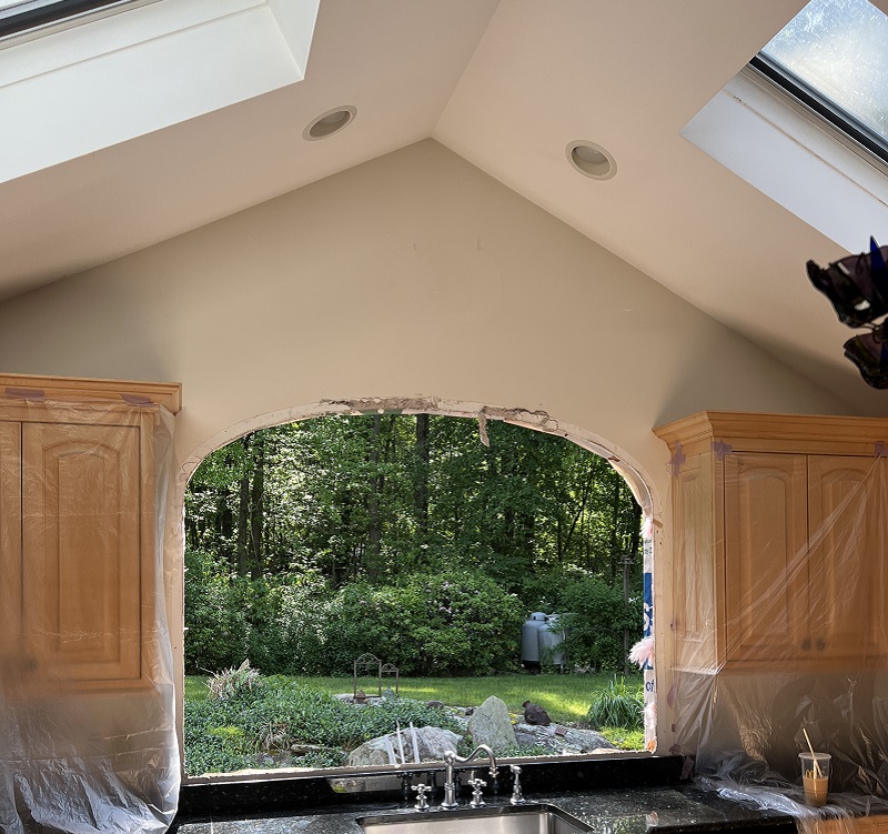 Remove the trim and frame to install the new window